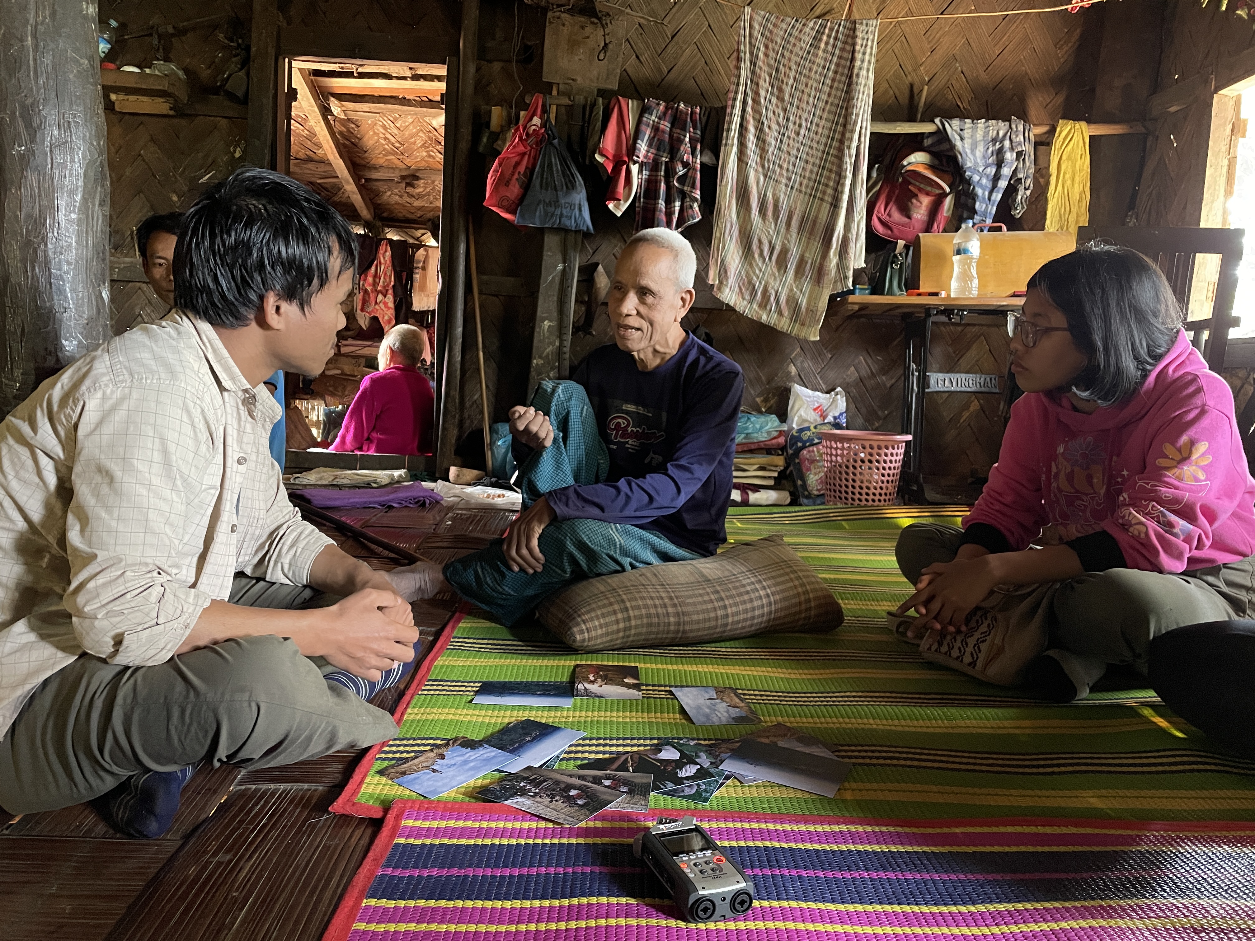Students interviewing Menpong Mro, head of Empu Para village, where Lorenz Löffler did field research in 1956.
